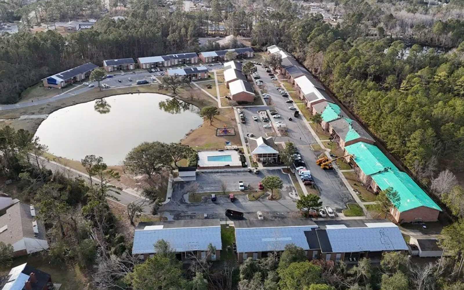 Close-up of a residential roof under installation, showing roofing materials and wooden decking in Orlando, Florida.